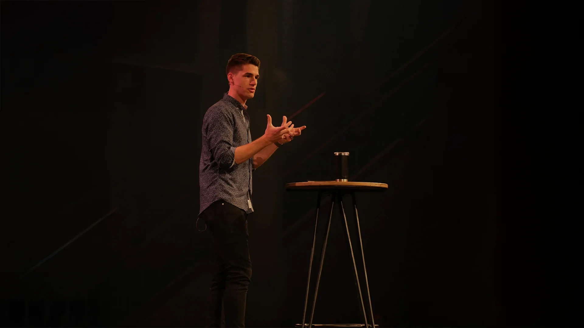 Jon Boettcher speaking on a stage